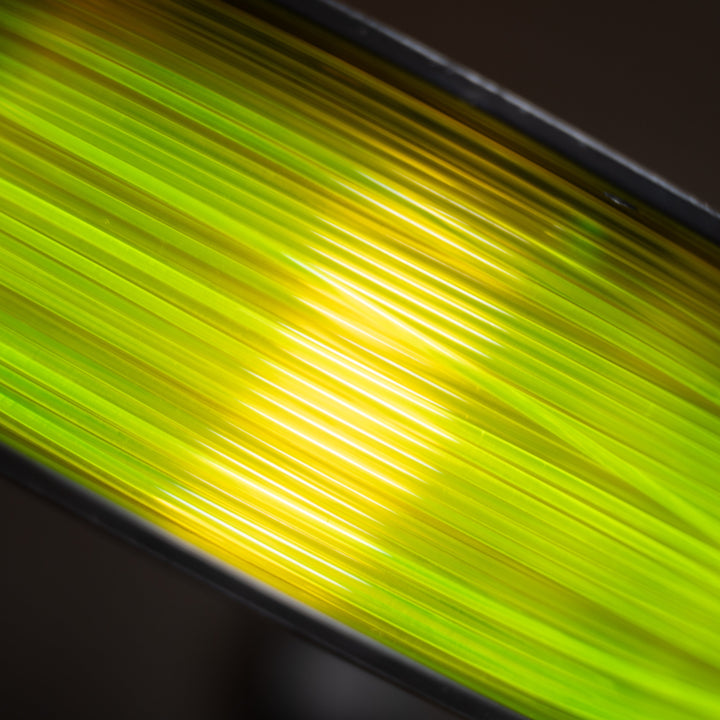 Close-up of a green glowing object with a dark background